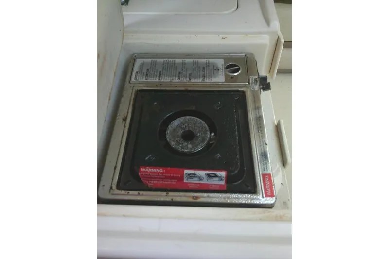 Slide: The Image of Built-in stove on 2000 Grady-White Sailfish 272 boat, featuring a single burner. - 46