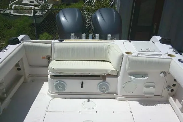 Slide: The Image of 2000 Grady-White Sailfish 272 boat interior with seating and dual engines. - 49