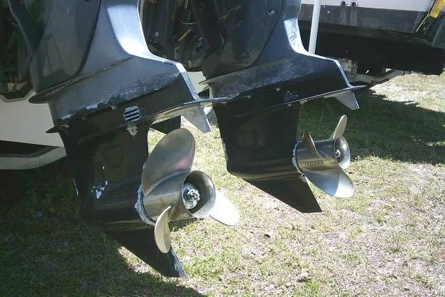 Slide: The Image of Twin outboard motors on a 2000 Grady-White Sailfish 272 boat, showcasing propellers. - 8