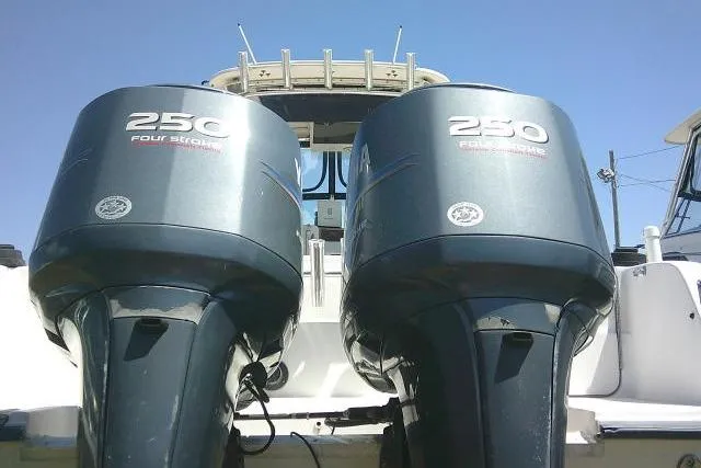 Slide: The Image of Twin 250 horsepower outboard engines on a 2000 Grady-White Sailfish 272 boat. - 9