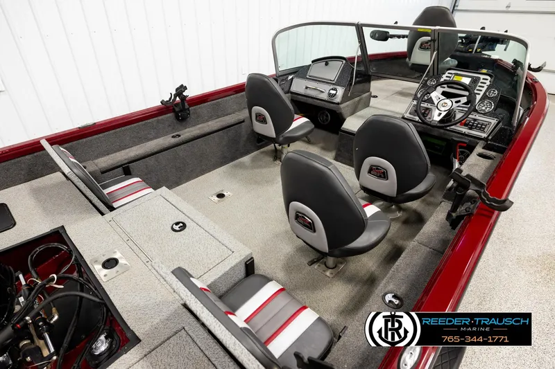 Slide: The Image of 2018 Ranger VS1882 WT boat interior with seating and control panel, Reeder-Trausch Marine logo visible. - 11