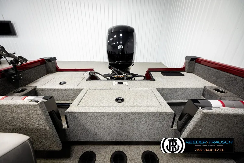 Slide: The Image of 2018 Ranger VS1882 WT boat interior with motor, gray seating, and storage compartments. - 20