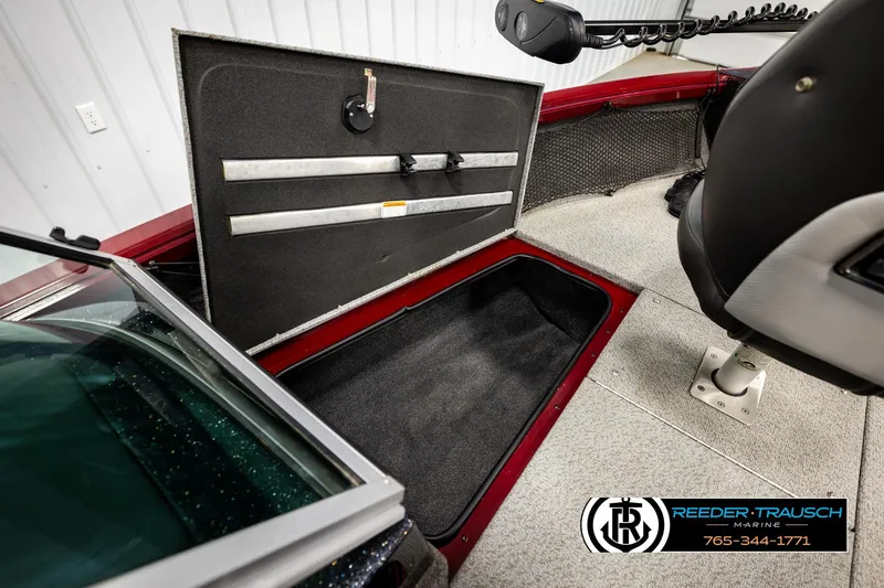 Slide: The Image of 2018 Ranger VS1882 WT boat interior with open storage compartment and seating. - 26