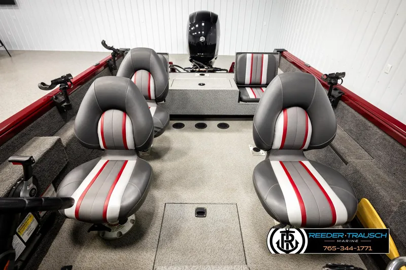 Slide: The Image of 2018 Ranger VS1882 WT boat interior with four gray and red seats, motor visible. - 30
