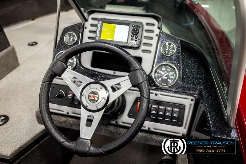 Slide: The Image of 2018 Ranger VS1882 WT boat dashboard with steering wheel and control panel. - 31