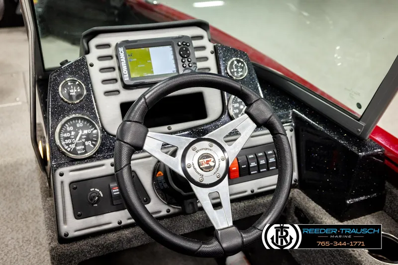 Slide: The Image of Dashboard of a 2018 Ranger VS1882 WT boat with steering wheel and navigation system. - 32
