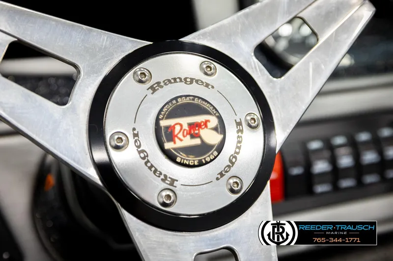 Slide: The Image of Steering wheel of 2018 Ranger VS1882 WT boat with Reeder-Trausch Marine logo. - 33
