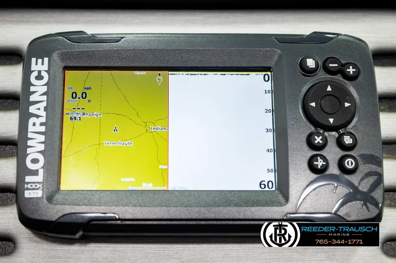 Slide: The Image of Lowrance GPS device displaying map, featuring Reeder-Trausch Marine branding. - 36