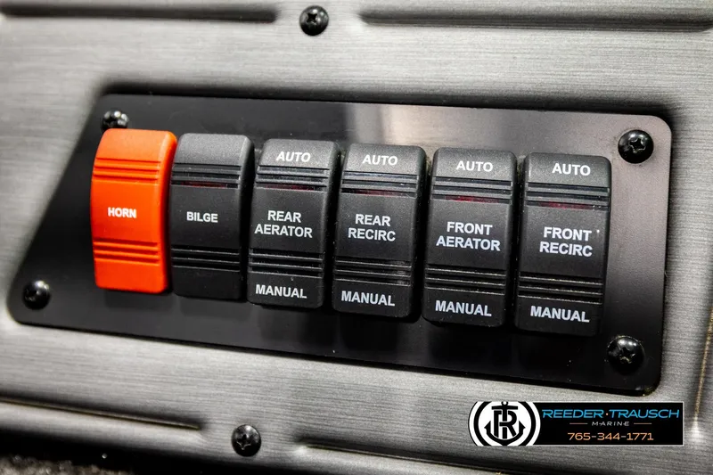 Slide: The Image of Control panel of a 2018 Ranger VS1882 WT boat with labeled switches. - 38
