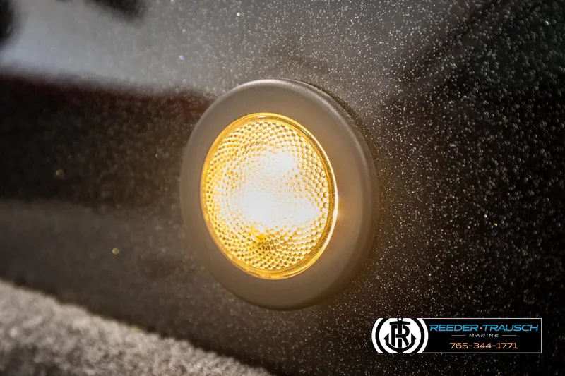 Slide: The Image of Close-up of a 2018 Ranger VS1882 WT boat light with textured surface. - 44
