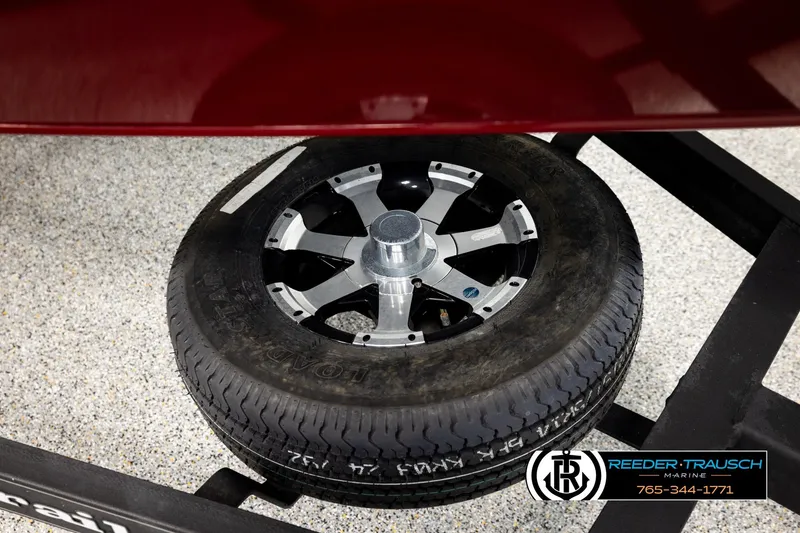 Slide: The Image of 2018 Ranger VS1882 WT spare tire on a trailer, Reeder-Trausch Marine branding visible. - 59