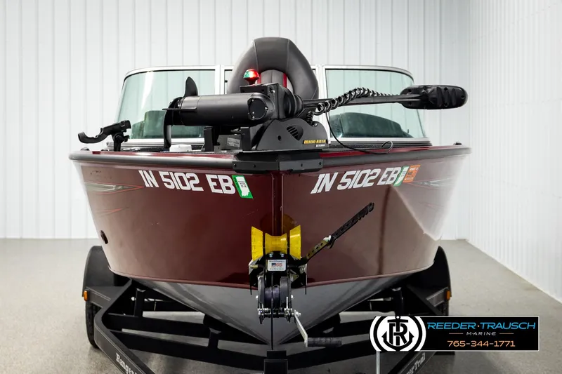 Slide: The Image of 2018 Ranger VS1882 WT boat in showroom, featuring maroon exterior and trailer. - 7