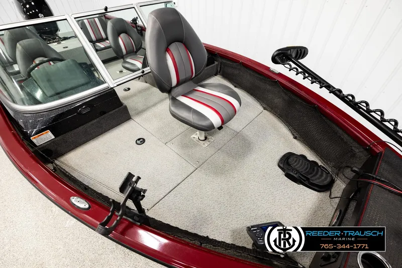Slide: The Image of 2018 Ranger VS1882 WT boat interior with gray and red seating, steering console, and foot pedal. - 8
