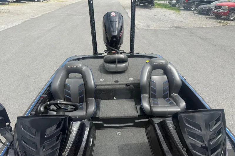 Slide: The Image of 2019 Nitro Z21 Pro boat interior with dual seats and steering wheel. - 10