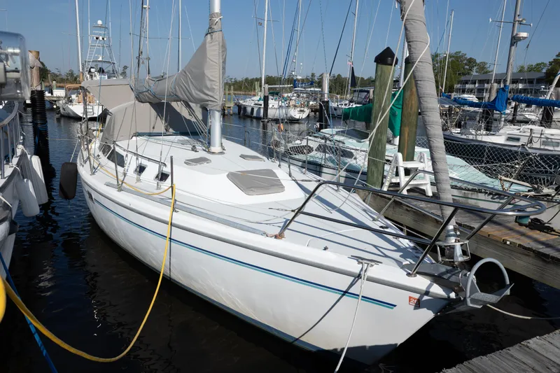 The Image of Sailboat Catalina 36 MkII 1996 docked at marina with other boats. - 1
