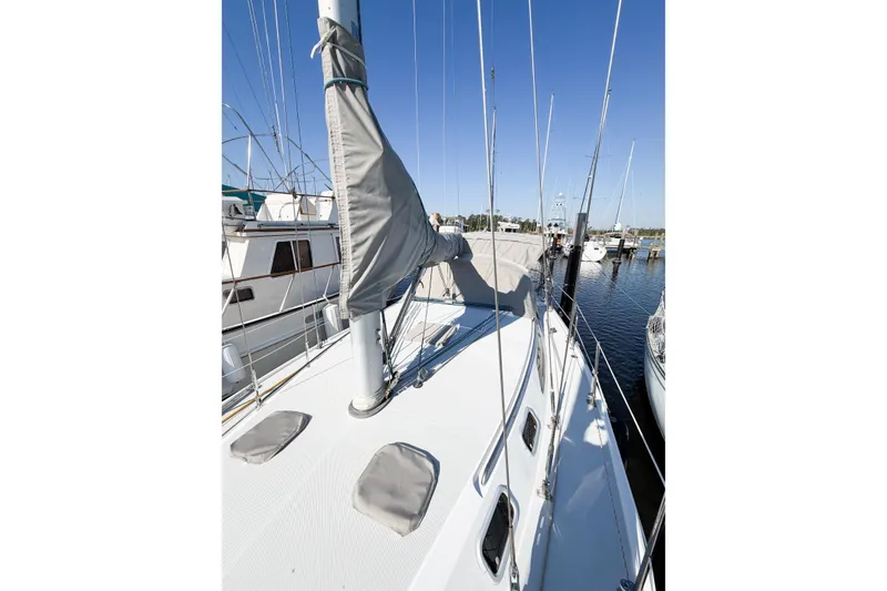 Slide: The Image of 1996 Catalina 36 MkII sailboat deck view at marina, clear blue sky. - 11