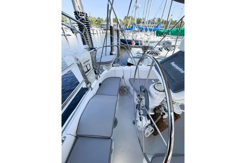 Slide: The Image of Cockpit of 1996 Catalina 36 MkII sailboat with steering wheel and navigation equipment. - 14