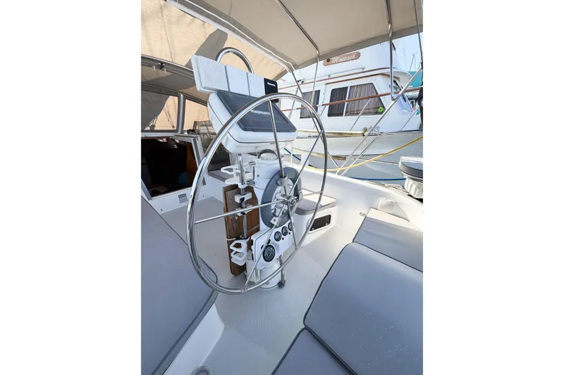 Slide: The Image of Steering wheel of a 1996 Catalina 36 MkII sailboat, featuring a spacious cockpit design. - 19