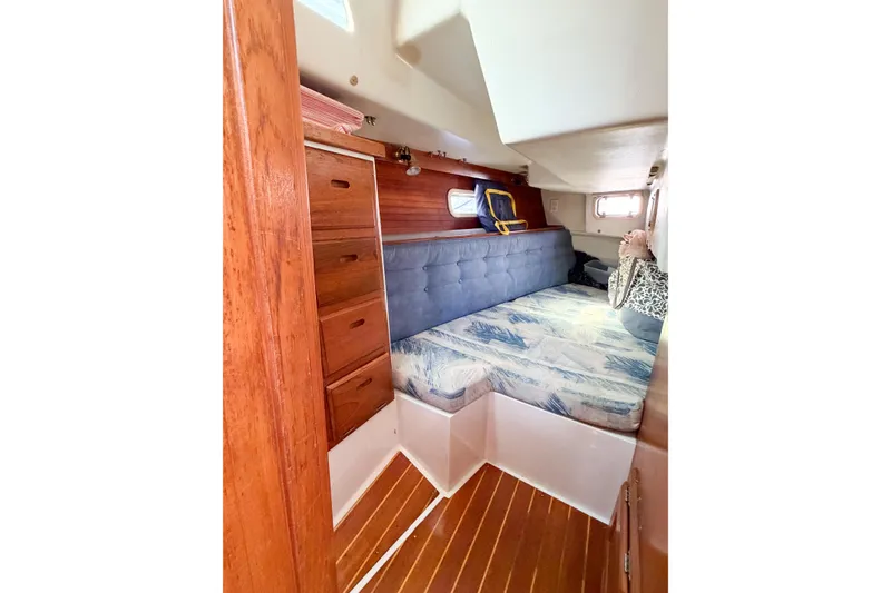 Slide: The Image of Cozy cabin interior of 1996 Catalina 36 MkII sailboat with wooden drawers and cushioned seating. - 21