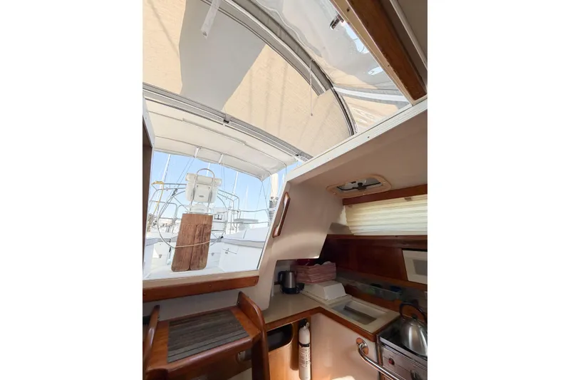 Slide: The Image of Interior view of a 1996 Catalina 36 MkII sailboat, showcasing the galley and cockpit area. - 22
