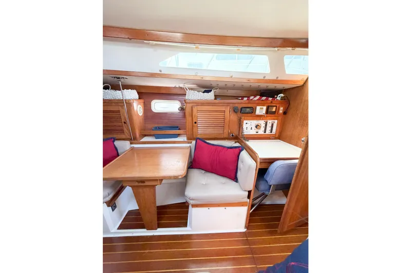 Slide: The Image of Interior of 1996 Catalina 36 MkII sailboat with wooden furnishings and cozy seating area. - 27