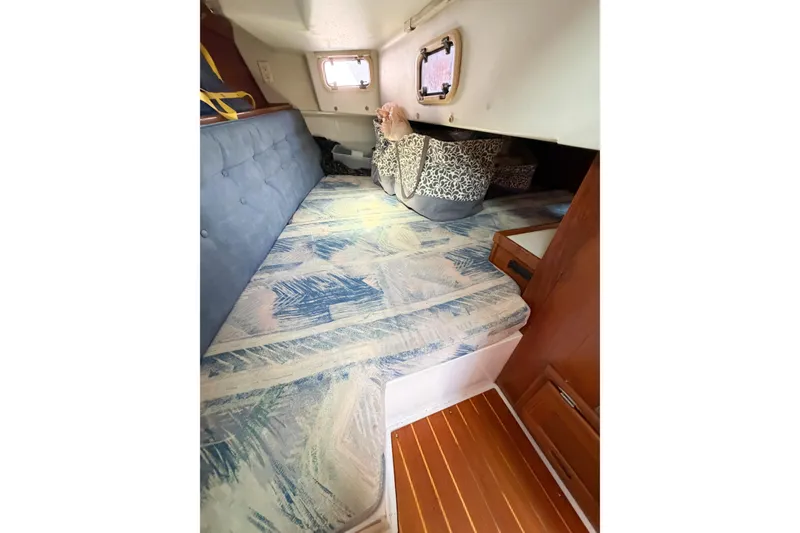 Slide: The Image of Interior cabin of a 1996 Catalina 36 MkII sailboat with patterned cushions. - 29