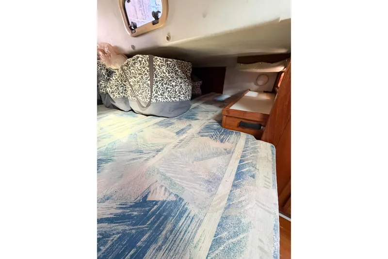 Slide: The Image of Cozy cabin interior of 1996 Catalina 36 MkII sailboat with patterned bedding. - 30