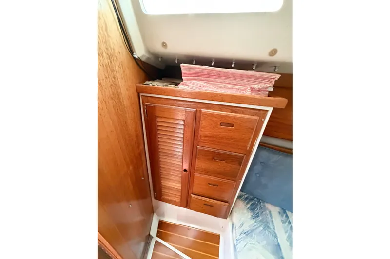 Slide: The Image of Wooden cabinet with drawers inside a 1996 Catalina 36 MkII sailboat cabin. - 31
