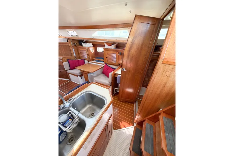 Slide: The Image of Interior of 1996 Catalina 36 MkII sailboat with wooden finishes and cozy seating area. - 35