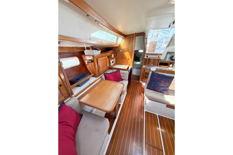Slide: The Image of Interior of 1996 Catalina 36 MkII sailboat with wooden finishes and cozy seating. - 39