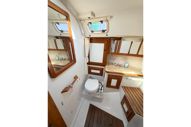 Slide: The Image of Bathroom interior of 1996 Catalina 36 MkII yacht with wooden accents and fixtures. - 42