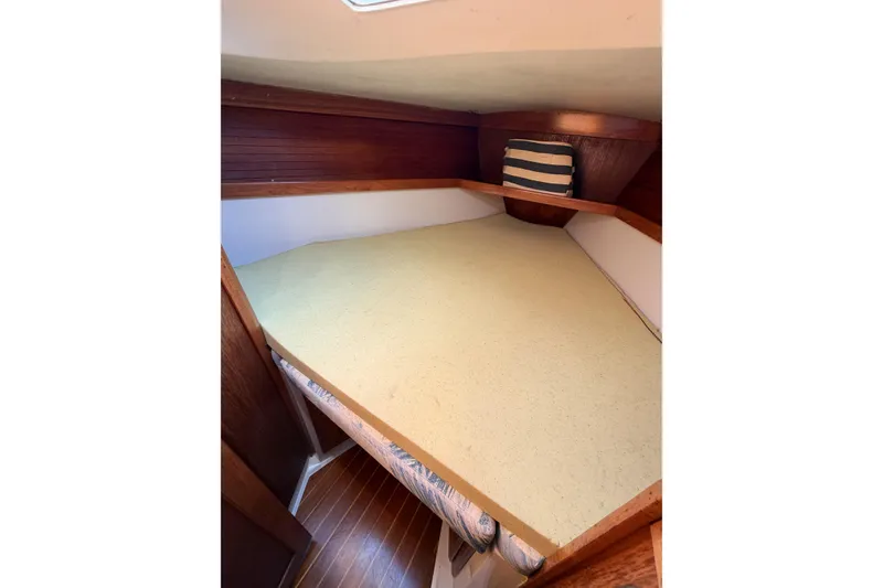 Slide: The Image of Cozy cabin interior of 1996 Catalina 36 MkII sailboat with striped pillow. - 48