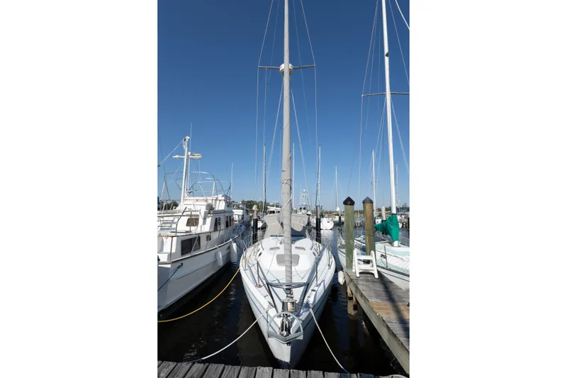 Slide: The Image of 1996 Catalina 36 MkII sailboat docked at marina under clear blue sky. - 5