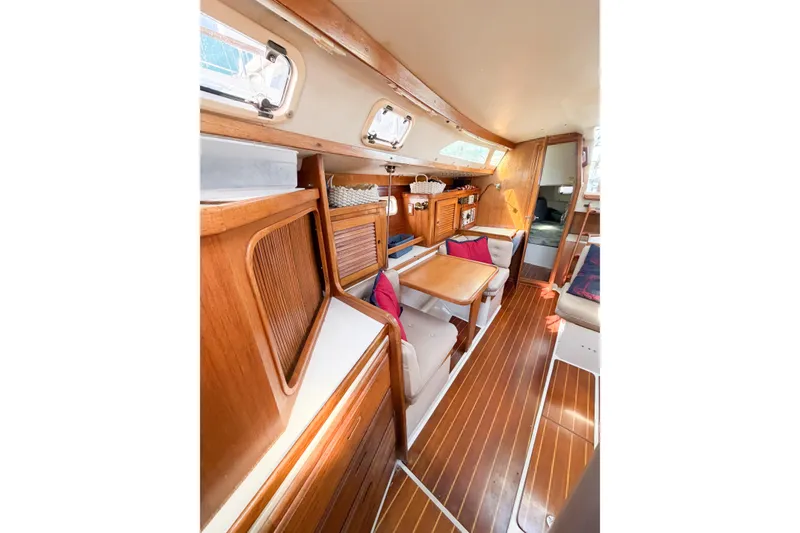 Slide: The Image of Interior of 1996 Catalina 36 MkII sailboat with wooden cabinetry and seating area. - 50