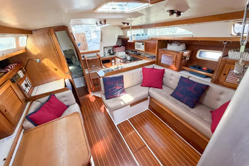 Slide: The Image of Interior of a 1996 Catalina 36 MkII sailboat with cozy seating and wooden finishes. - 51