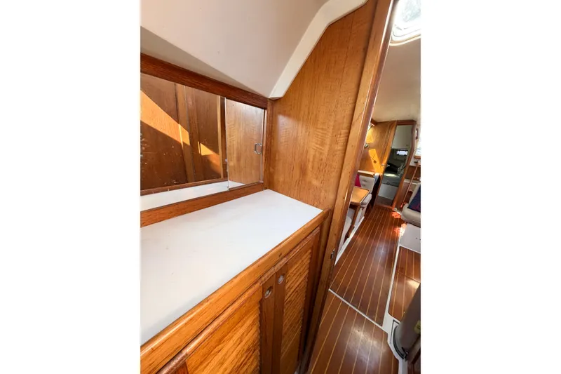 Slide: The Image of Interior of 1996 Catalina 36 MkII sailboat with wooden cabinetry and flooring. - 54