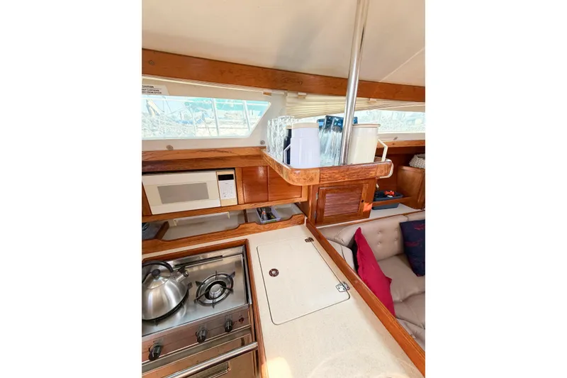 Slide: The Image of Interior of 1996 Catalina 36 MkII sailboat with kitchen and seating area. - 56