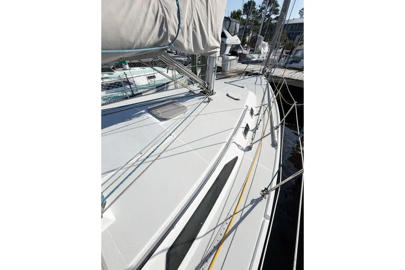 Slide: The Image of 1996 Catalina 36 MkII sailboat deck with rigging and docked at marina. - 6