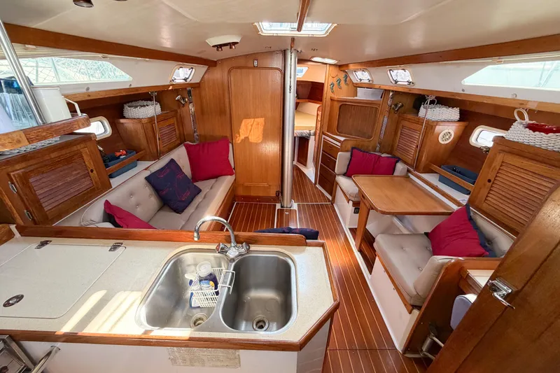 Slide: The Image of Interior of a 1996 Catalina 36 MkII sailboat with cozy seating and wooden finishes. - 61