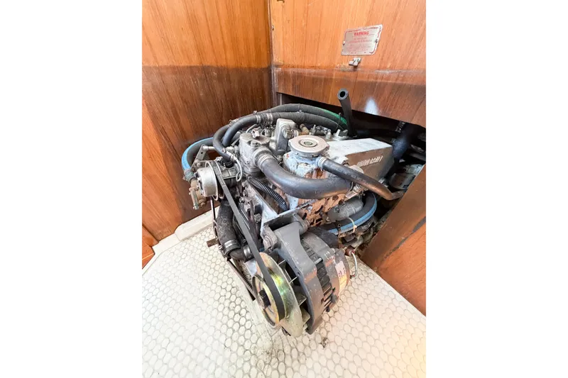 Slide: The Image of Engine of a 1996 Catalina 36 MkII sailboat, showing hoses and components. - 69