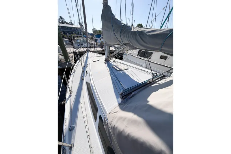Slide: The Image of 1996 Catalina 36 MkII sailboat docked, showcasing deck and rigging details. - 7