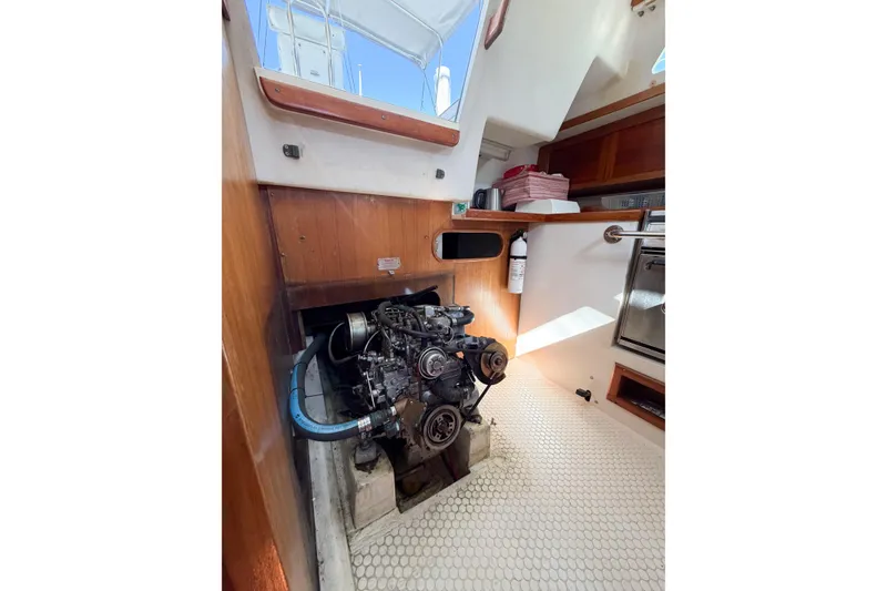 Slide: The Image of Engine compartment of a 1996 Catalina 36 MkII sailboat, showcasing interior details. - 73