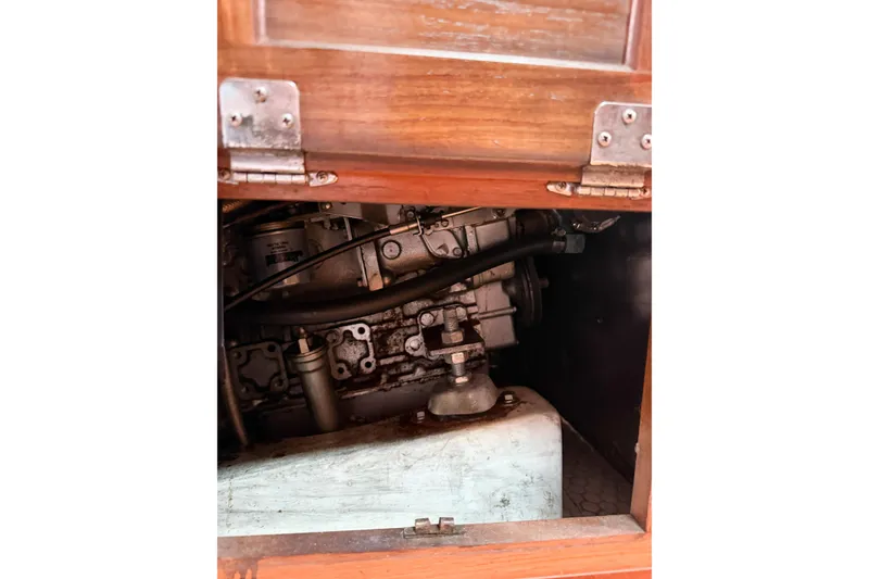 Slide: The Image of Engine compartment of a 1996 Catalina 36 MkII sailboat, showcasing mechanical components. - 74