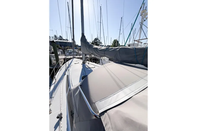 Slide: The Image of 1996 Catalina 36 MkII sailboat docked, covered mainsail, sunny marina setting. - 9