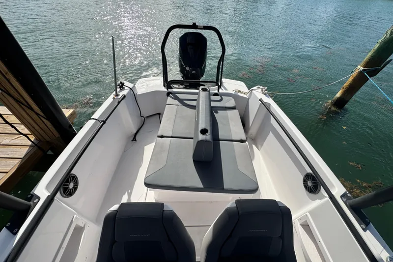 Slide: The Image of 2022 Axopar 22 T-Top boat interior with seating and water view. - 16