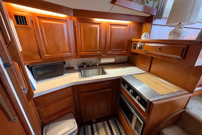 Slide: The Image of Helm of 1988 Viking 41 Convertible boat with dual seats and navigation equipment. - 17