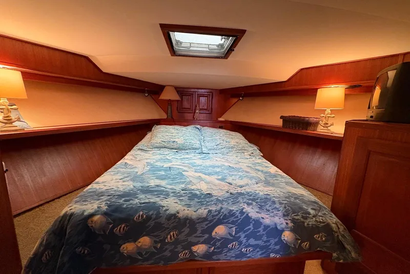 Slide: The Image of 1988 Viking 41 Convertible boat deck with ladder and storage compartments. - 18