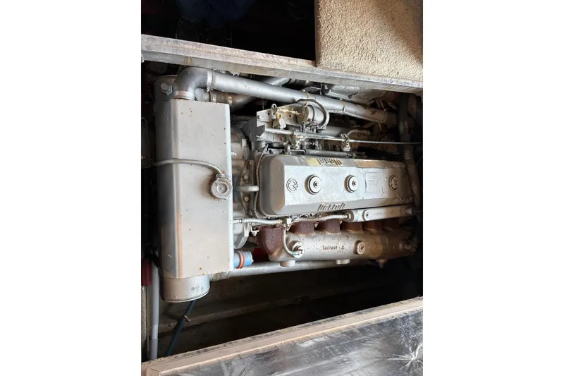 Slide: The Image of Interior of a 1988 Viking 41 Convertible yacht with cozy seating and wooden table. - 21