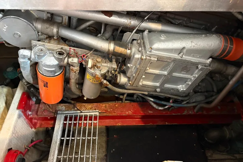 Slide: The Image of Engine compartment of a 1988 Viking 41 Convertible boat, showcasing mechanical components. - 30