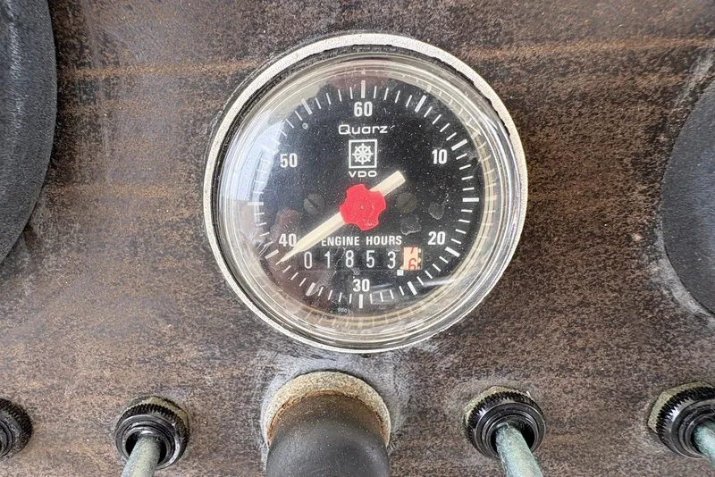 Slide: The Image of Close-up of a 1988 Viking 41 Convertible engine hour meter displaying 1853 hours. - 34